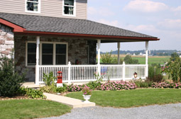 Porch posts and railings by L & J Pool, Fence & Deck Company